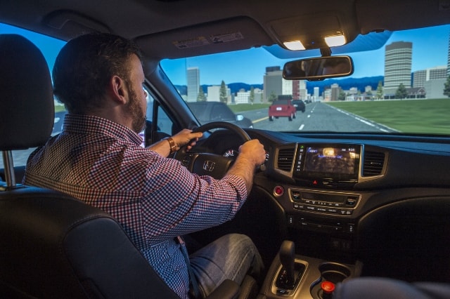 Shawn Sharp testing the Driving Simulator 